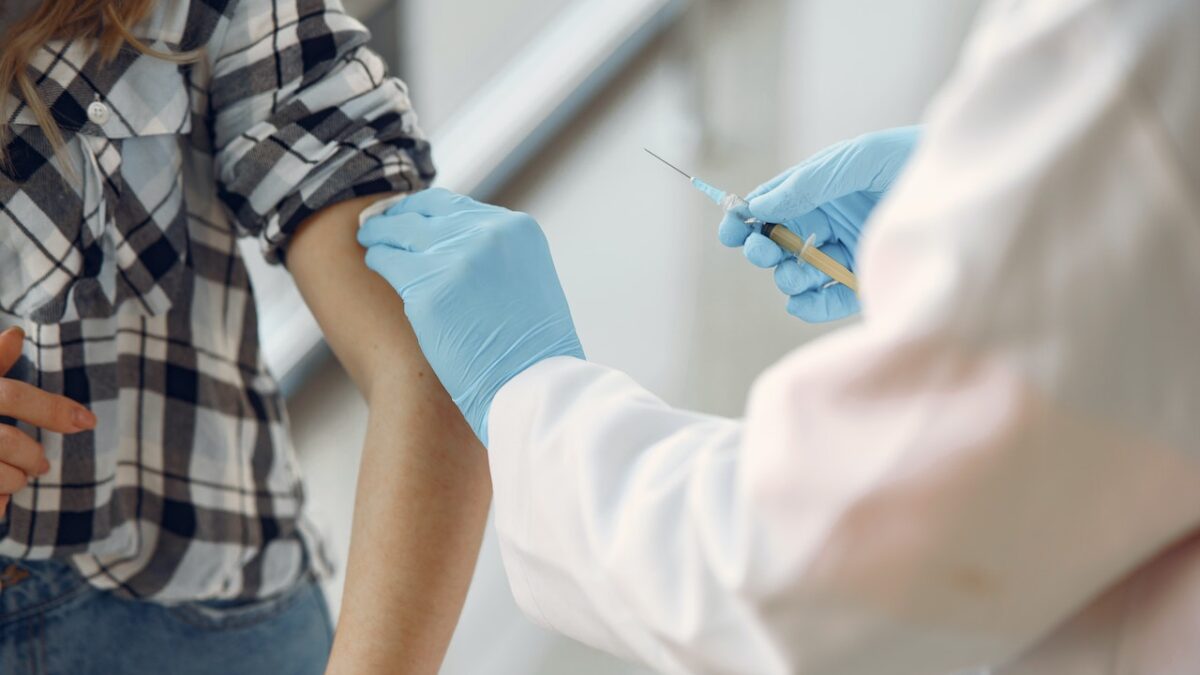 person getting vaccinated in the arm