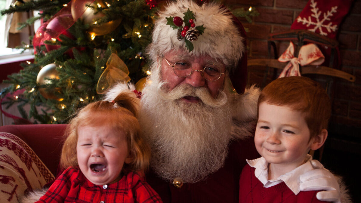 kids posing with Santa Claus