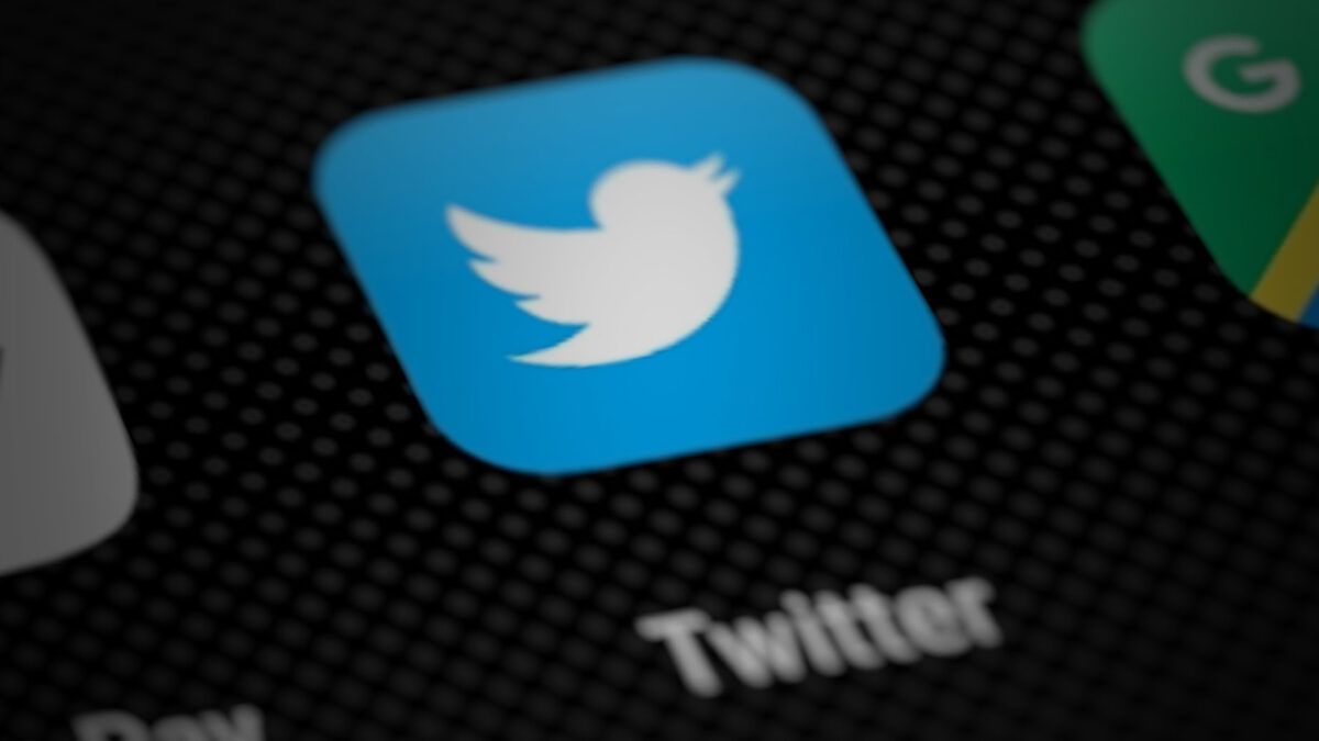 Twitter icon close-up on black phone screen