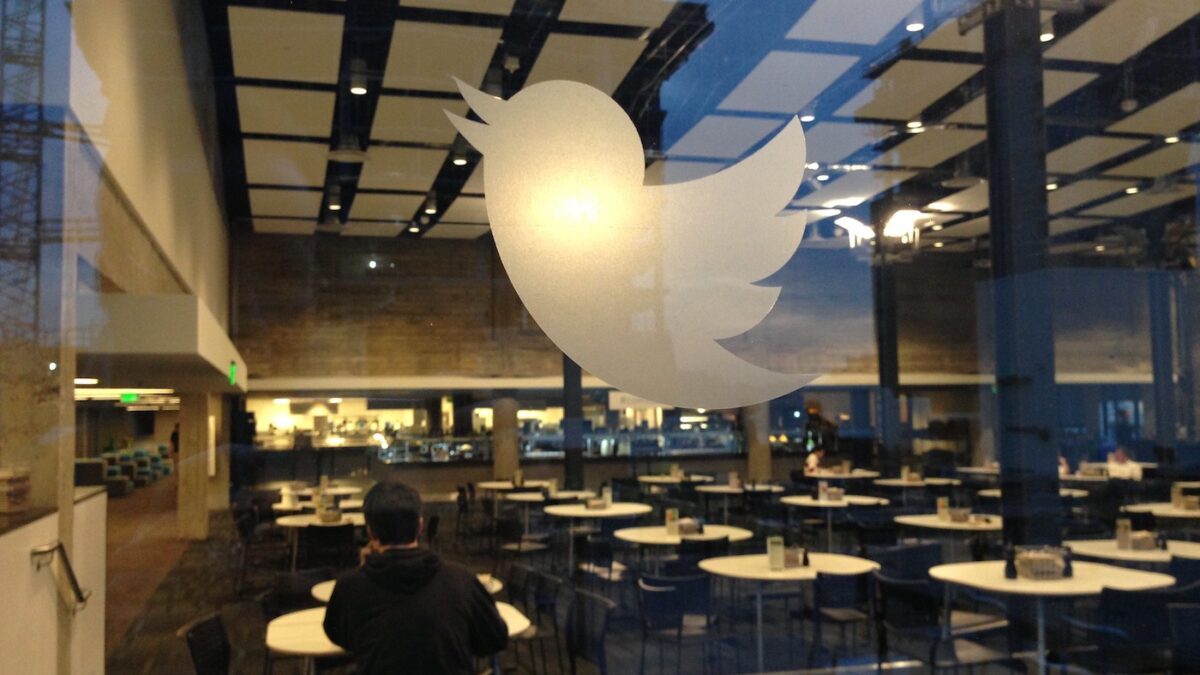 Twitter HQ through a glass window with logo