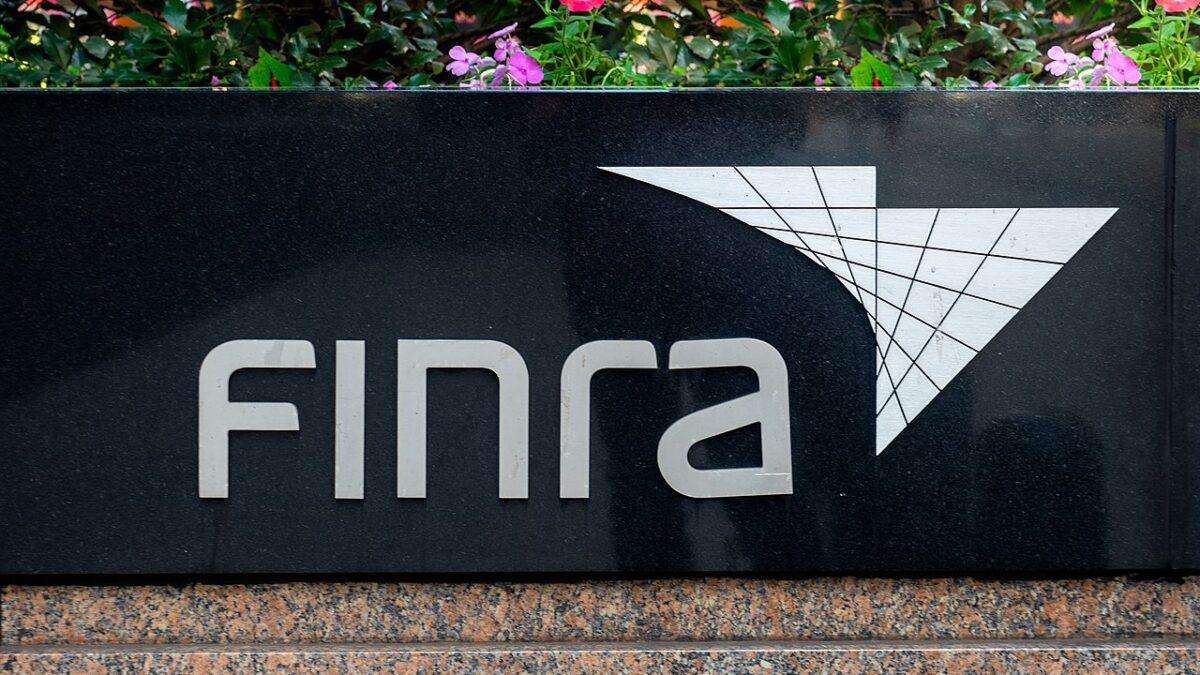 Black sign with logo for FINRA in NYC