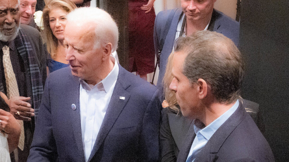 Joe and Hunter Biden surrounded by other people