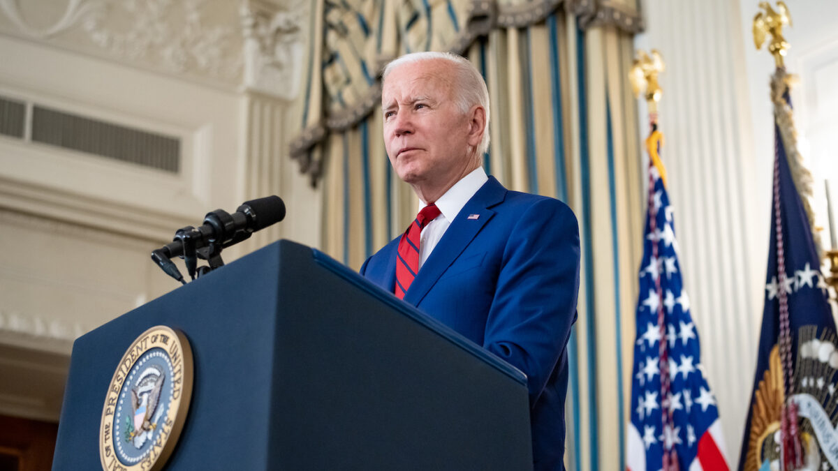 Joe Biden standing behind a podium