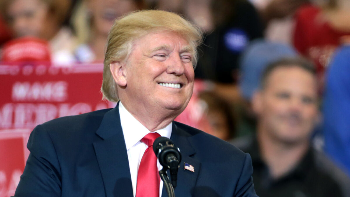 Donald Trump laughing at a rally