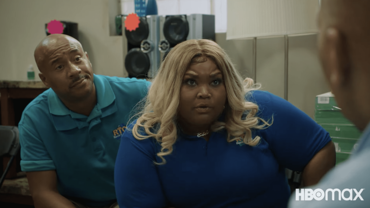 two characters on a comedy tv show in blue polo shirts