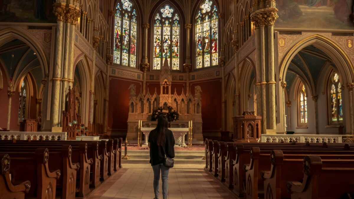 Woman standing in cathedral