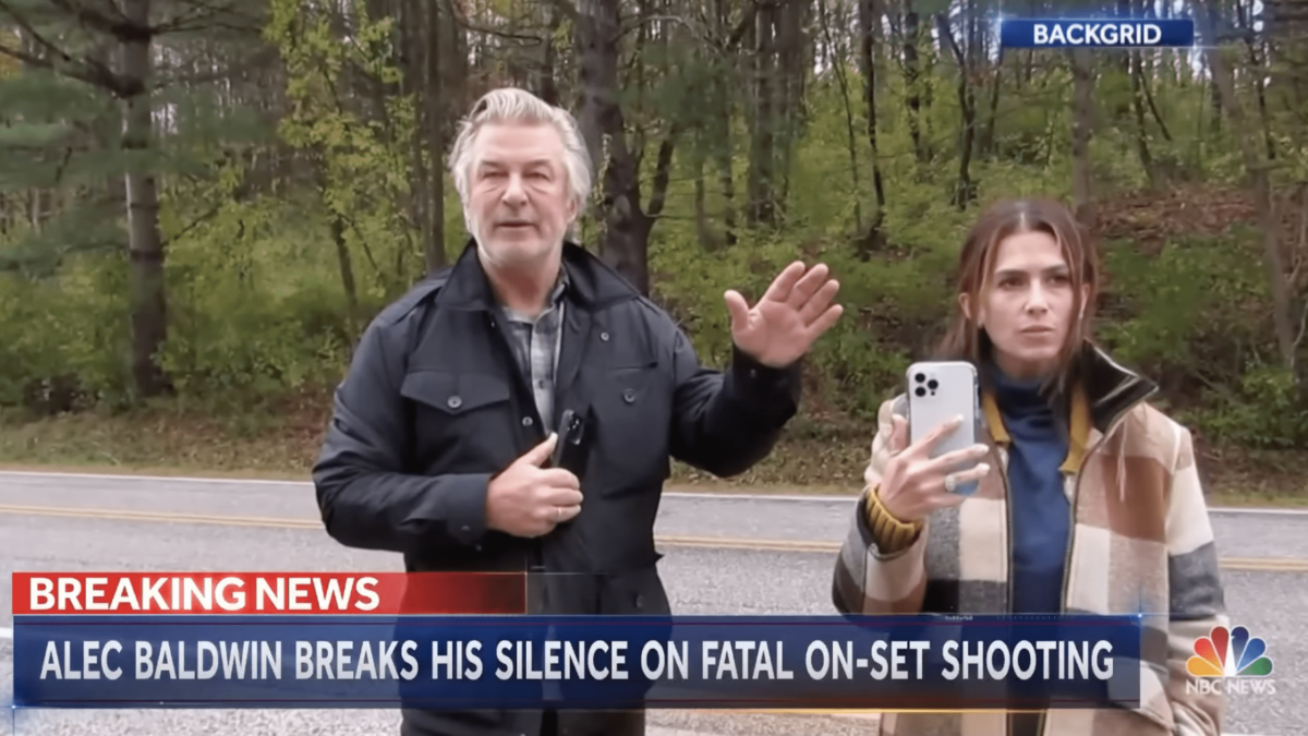 Alec Baldwin and his wife giving interview to reporters on the side of the highway