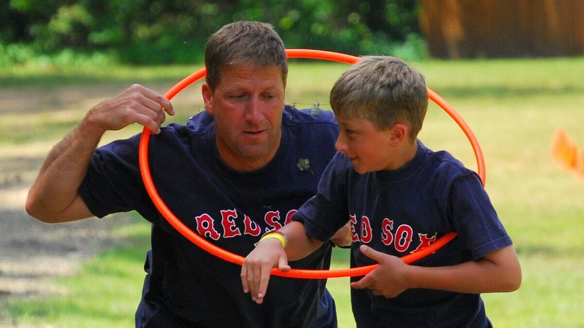 father and son with a hula hoop