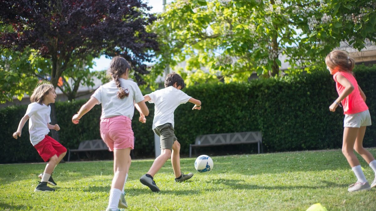 kids playing soccer outside
