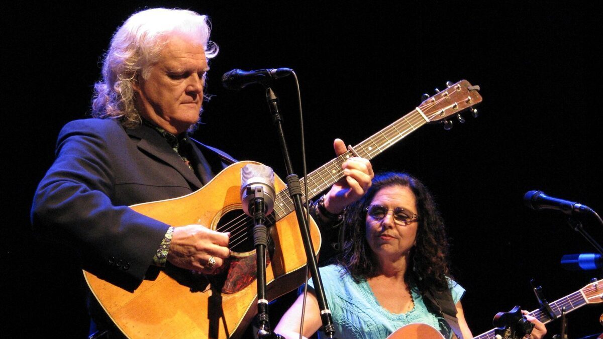 Ricky Skaggs playing guitar during a concert