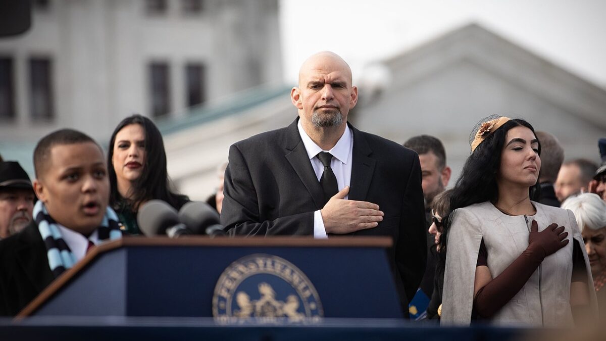 John and Gisele Fetterman with hands over hearts at Tom Wolf inauguration