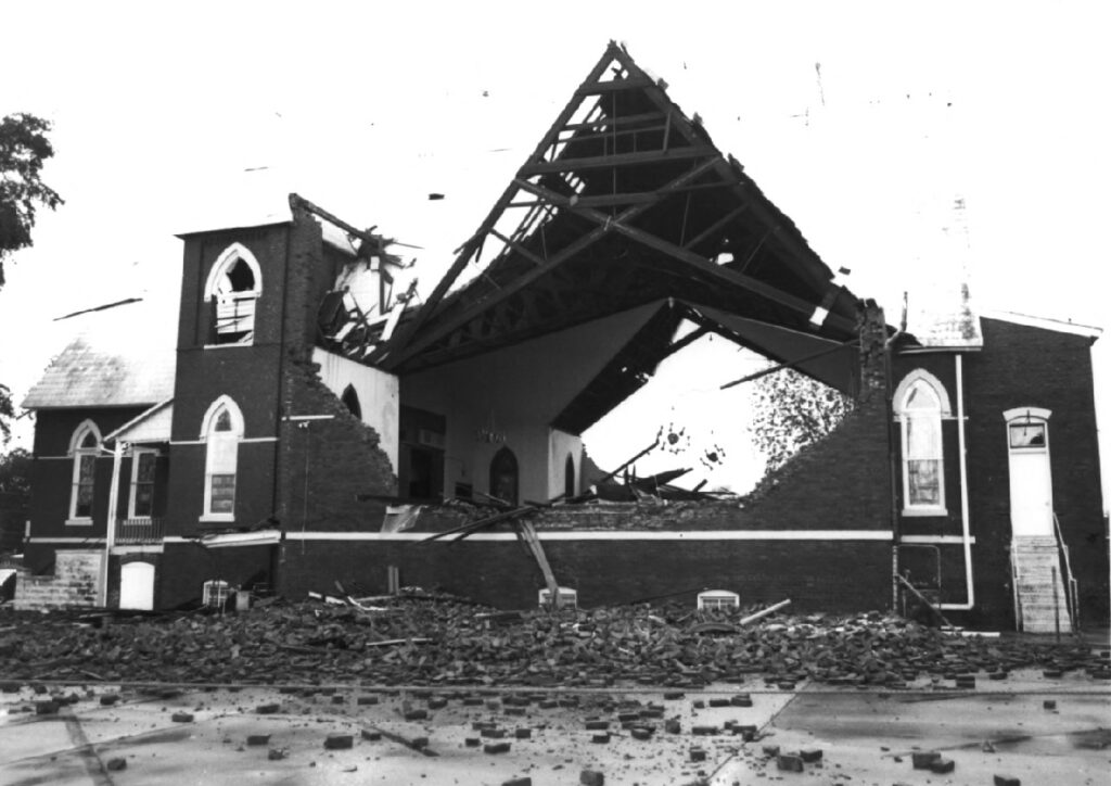 A picture of the first baptist church in 1978 shows the building destroyed after a tornado.