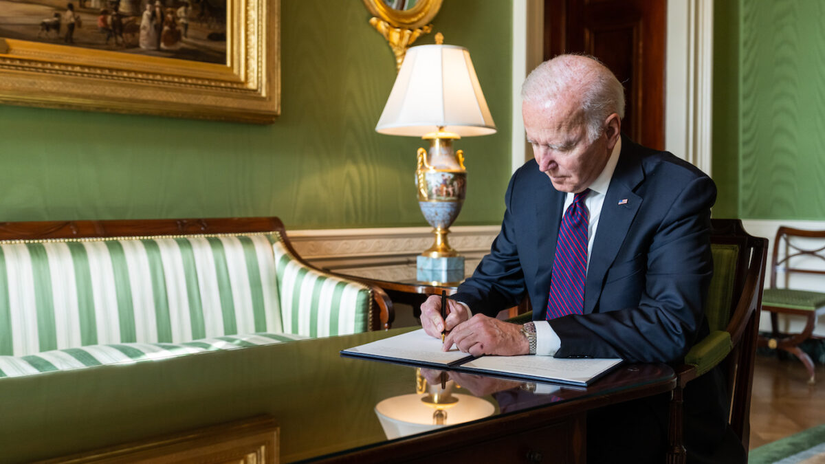 Joe Biden signing an executive order