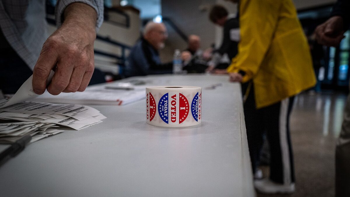roll of "I voted" stickers on a table at a polling place