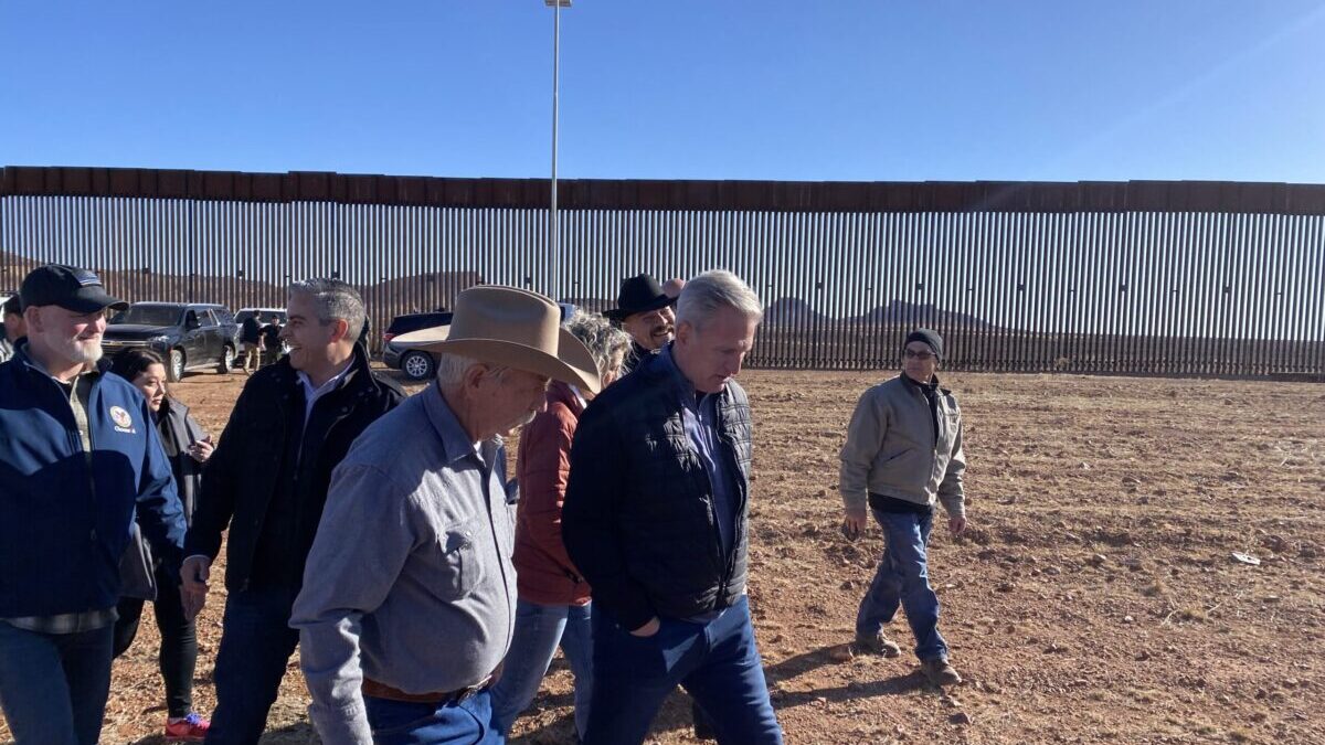 Kevin McCarthy walking in a group by the border in Arizona