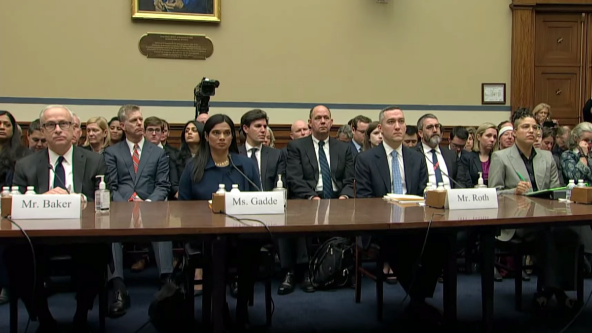 Twitter executives sit behind table at House hearing
