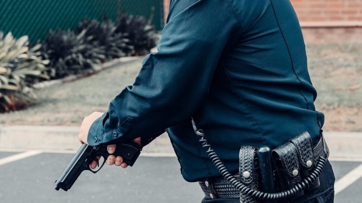 Cop holding a gun