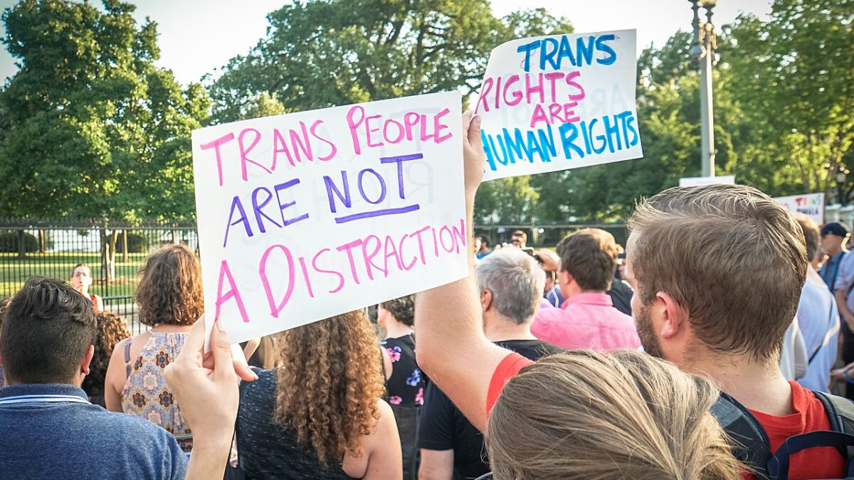transgender protesters holding signs