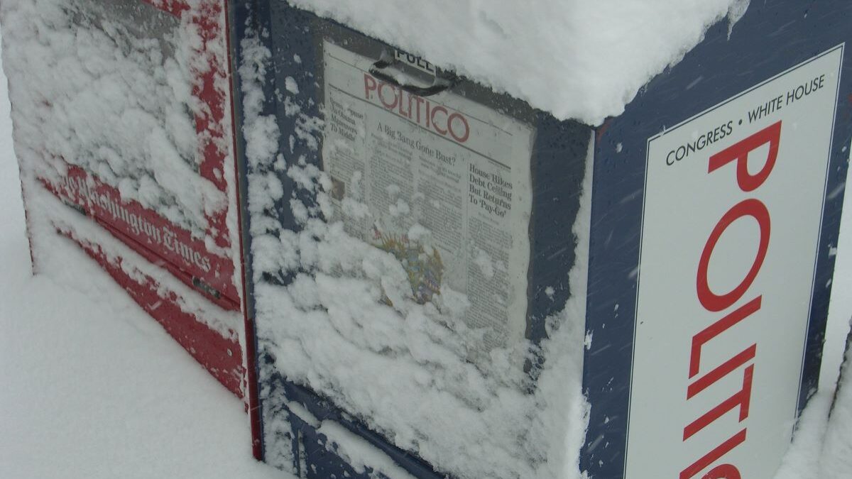 A Politico newspaper box in the snow