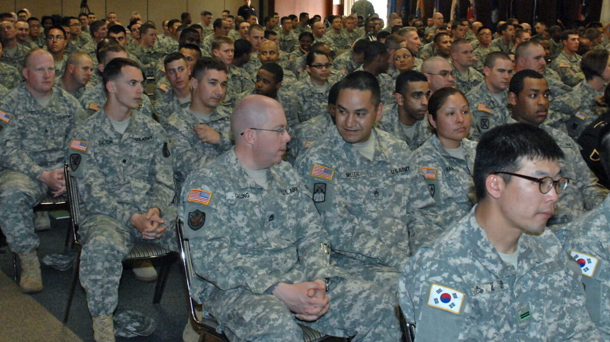 U.S. Army sitting in a room