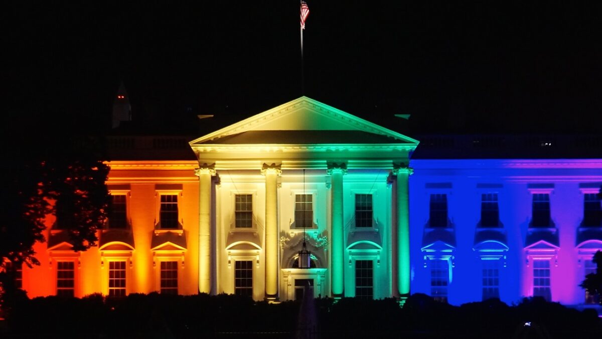 White House with rainbow lights projected onto it