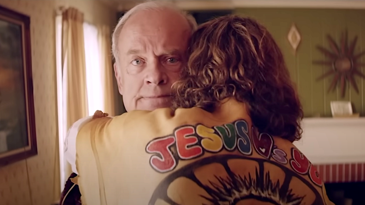 Jesus Revolution trailer screengrab of hippie hugging an older man