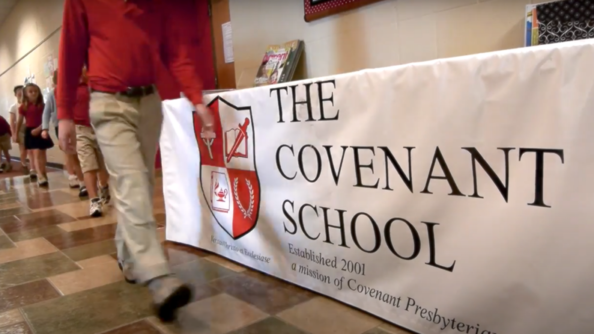 kids walking past a banner at Nashville Covenant School