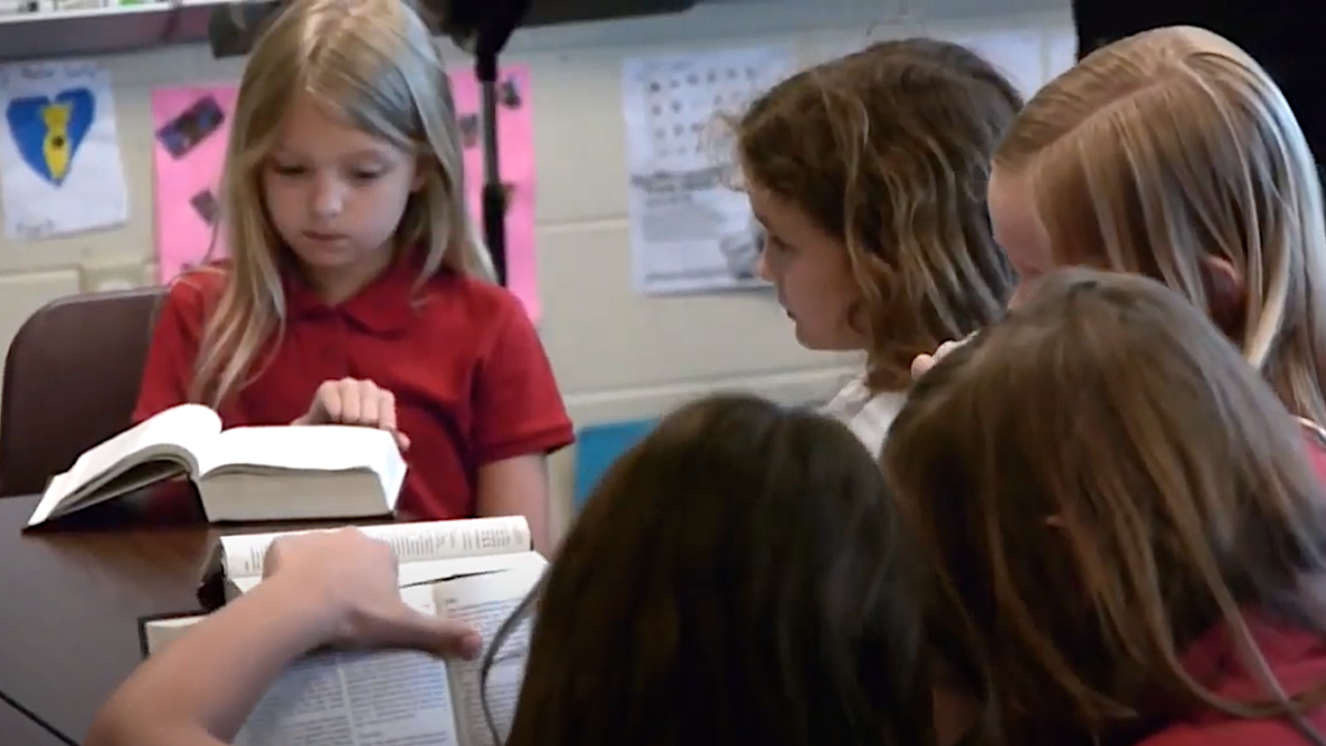 students of The Covenant School in Nashville reading Bibles