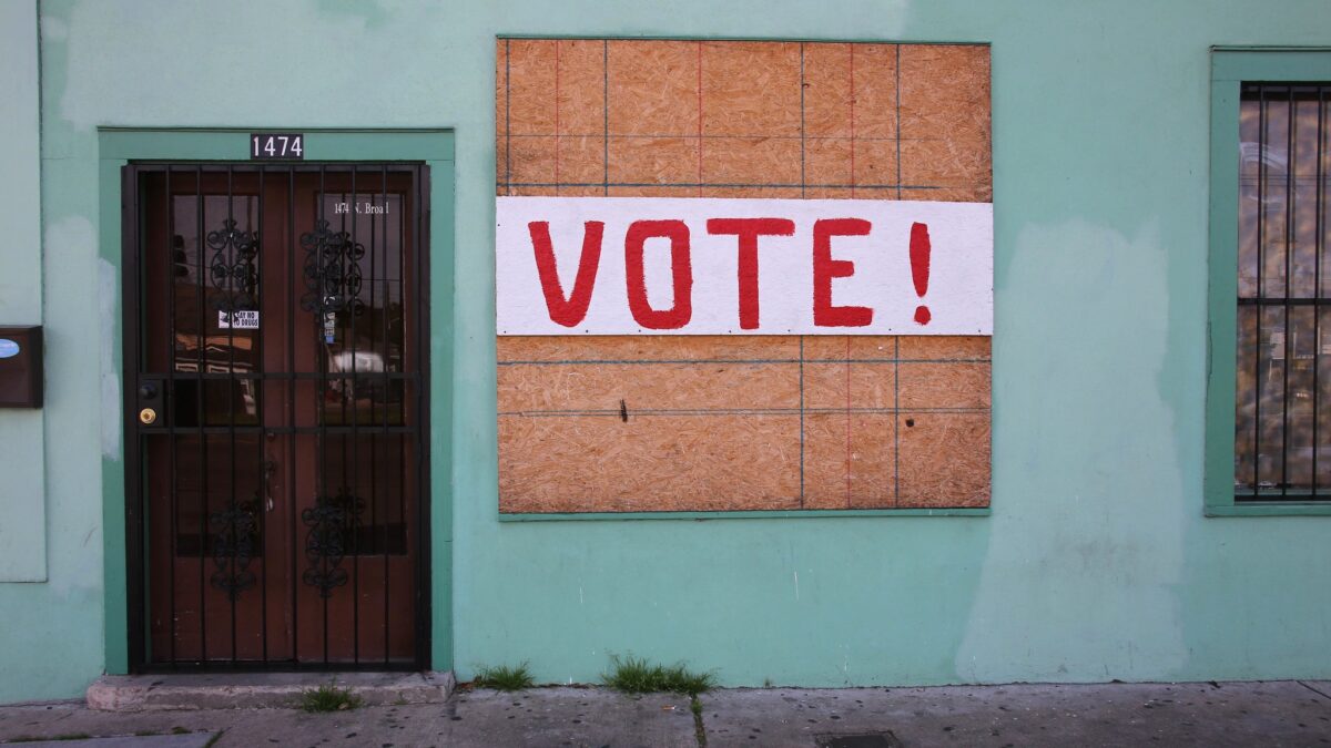 A sign telling people to vote