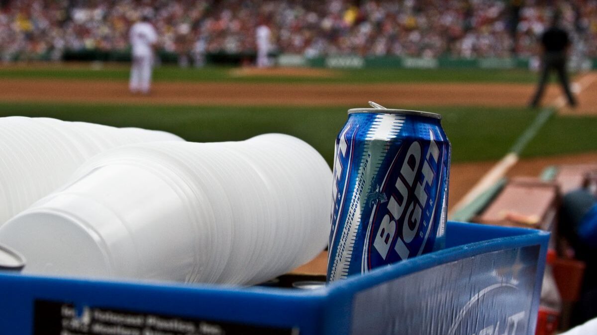 a can of Anheuser-Busch Bud Light in a cooler at a baseball game