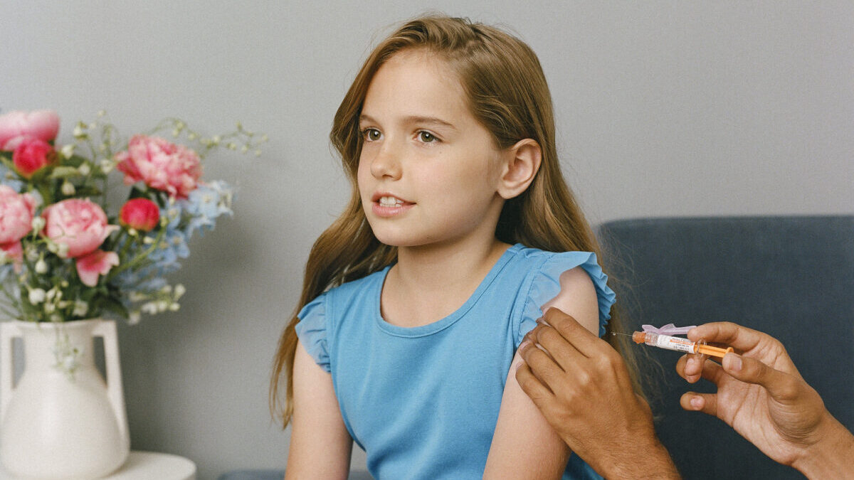 girl at doctor getting a shot