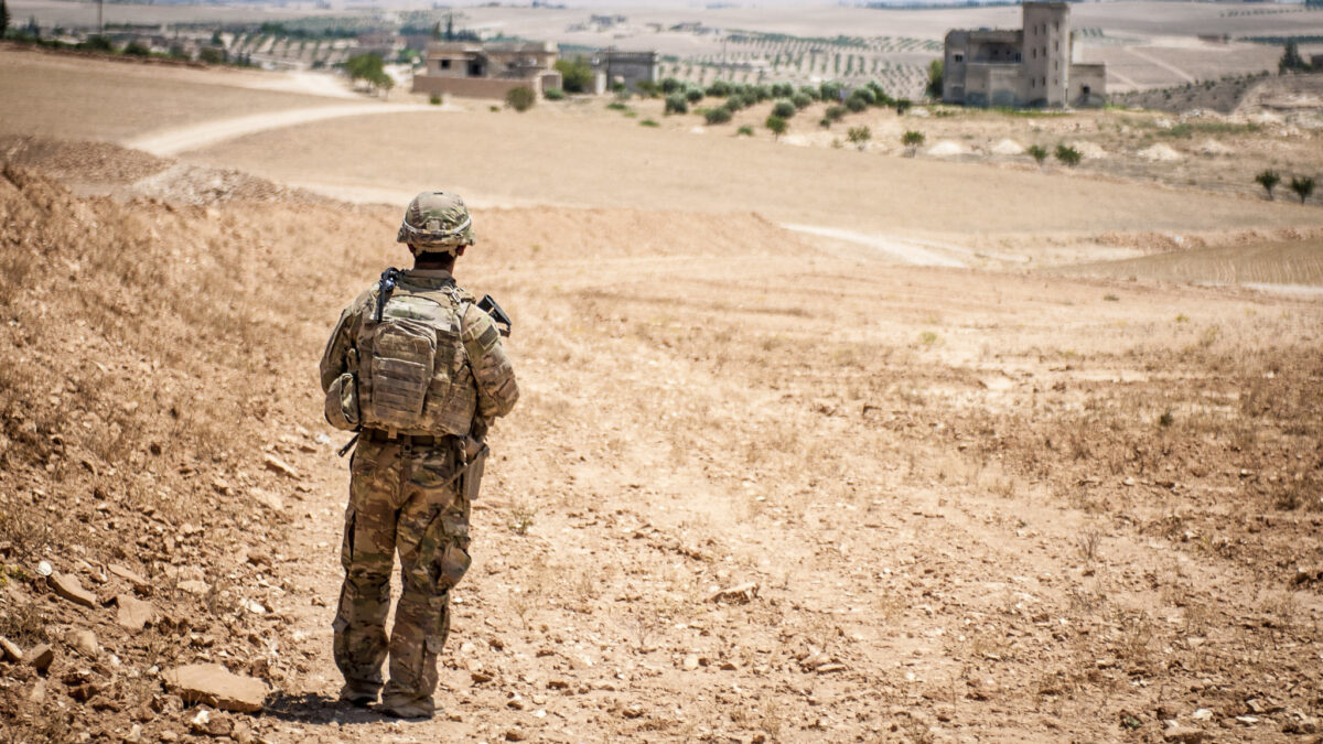 A U.S. Soldier provides security during a coordinated, independent patrol along the demarcation line near a village outside Manbij, Syria, June 26, 2018.