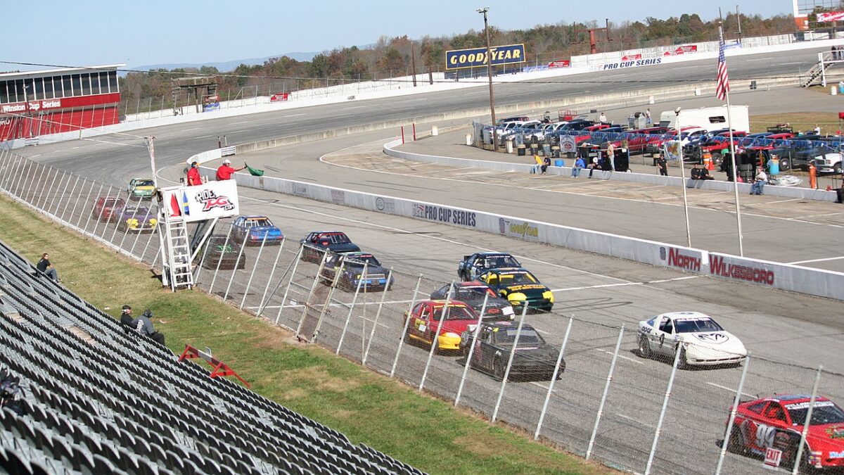 NASCAR drivers race on the North Wilkesboro Speedway.