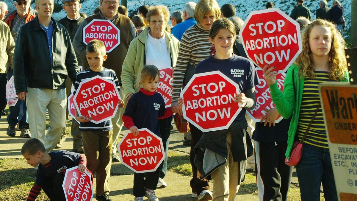 pro-life protestors with stop abortion signs