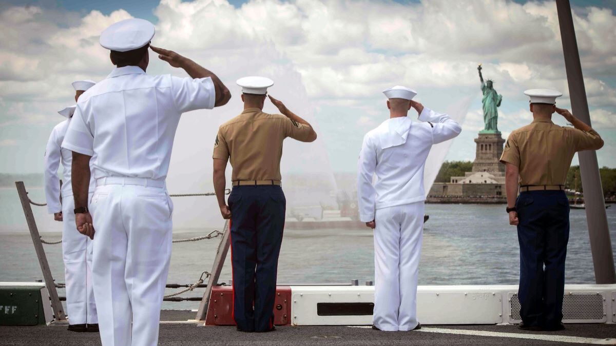 Navy sailors saluting the Statue of Liberty