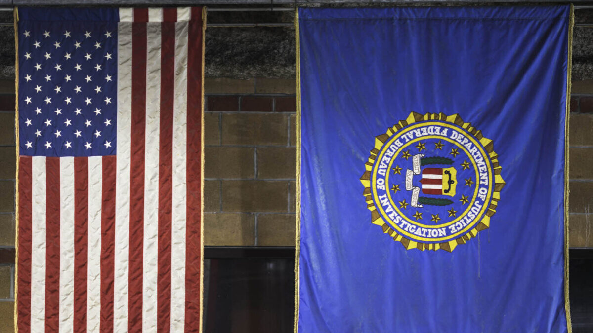 U.S. flag next to DOJ/FBI flag