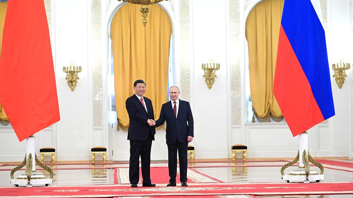Russia President Putin and China's Xi shaking hands