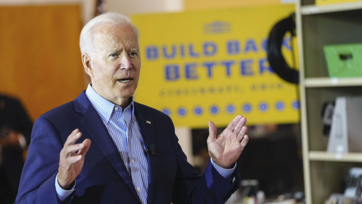 Joe Biden in front of Build Back Better sign