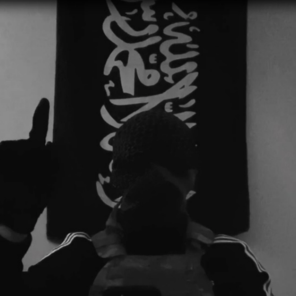 Screenshot of the video Bridges forwarded making the index-finger gesture of support for ISIS via court records