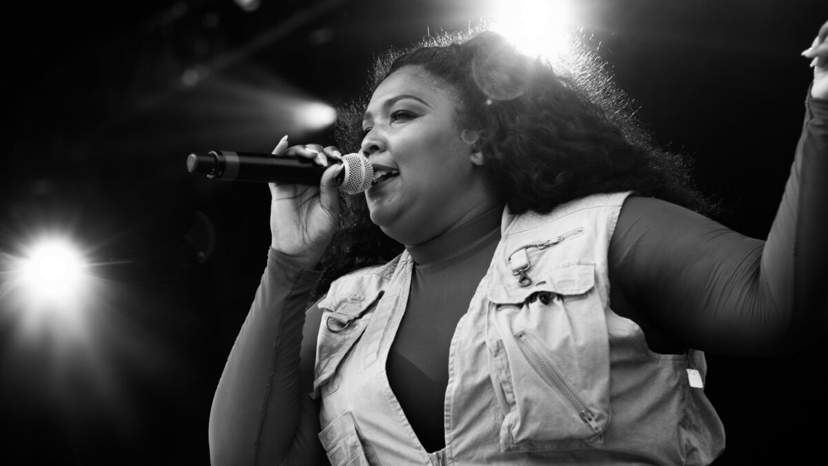 Lizzo holding a microphone