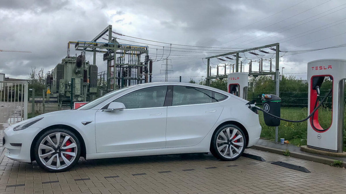Tesla at a charging station