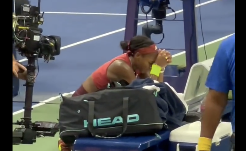 Coco Gauff prays on her knees after winning U.S. Open.