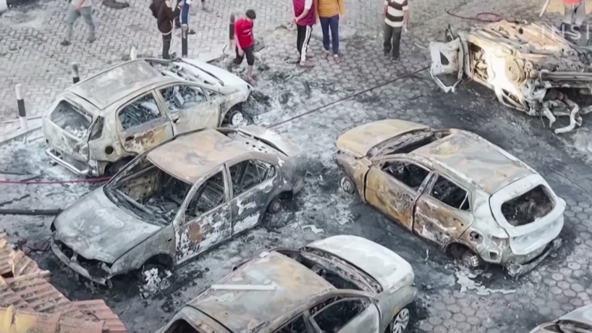 burned cars outside Gaza hospital