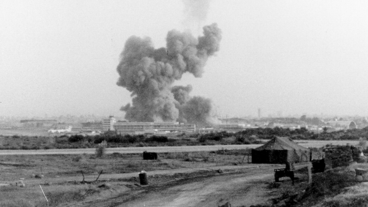 bomb going off in distant landscape