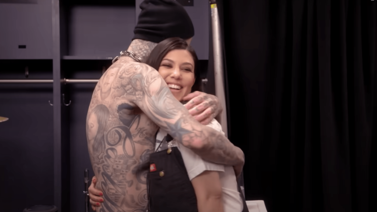 Travis and Kourtney Kardashian Barker embrace