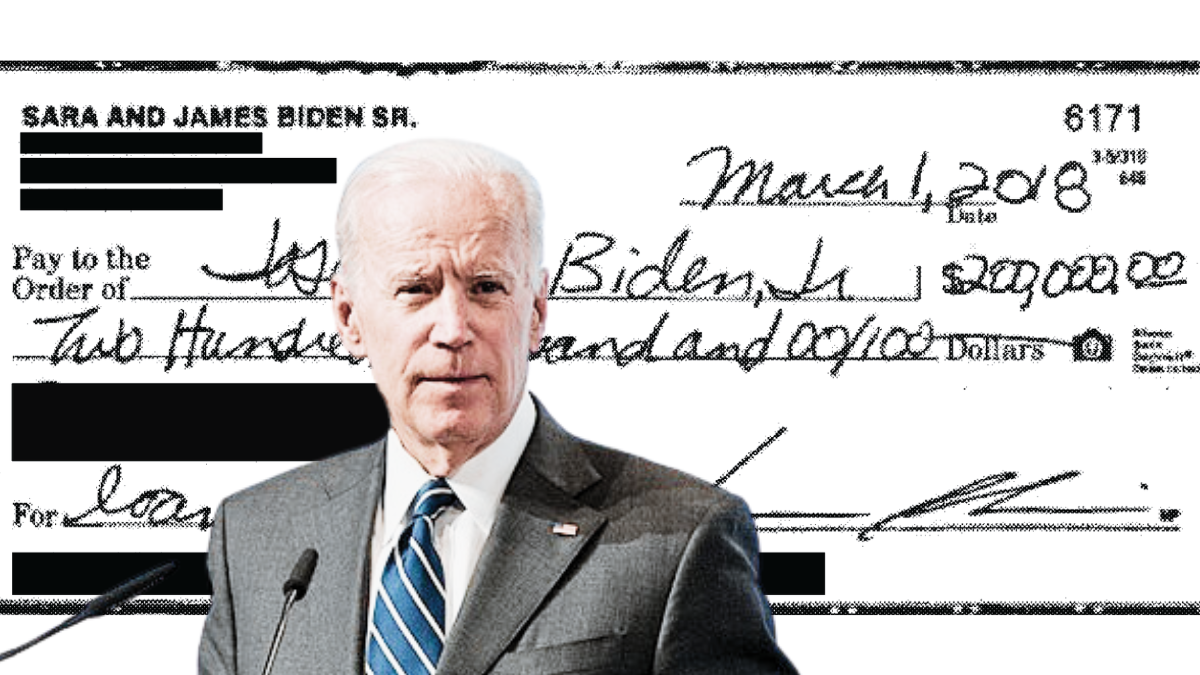 Joe BIden in front of Jim Biden's check