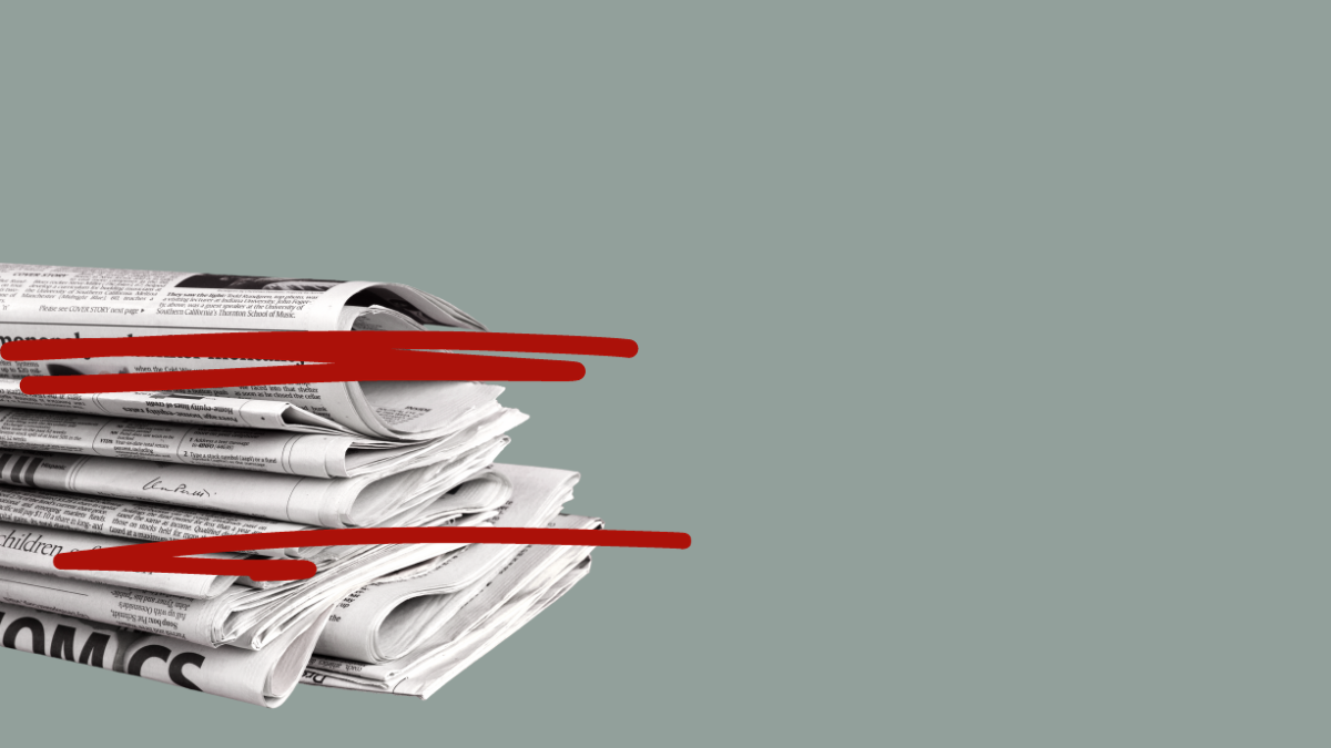 newspaper with red correction lines