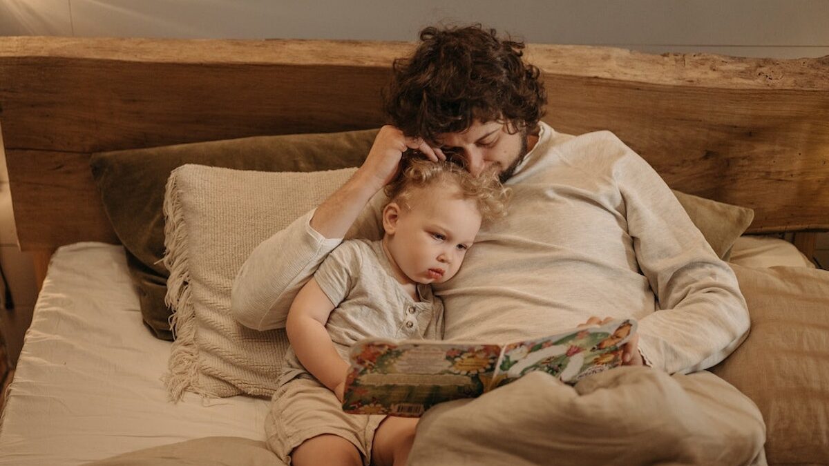 father reading his son a bedtime story