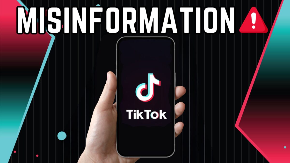 hand holding a phone with TikTok on it