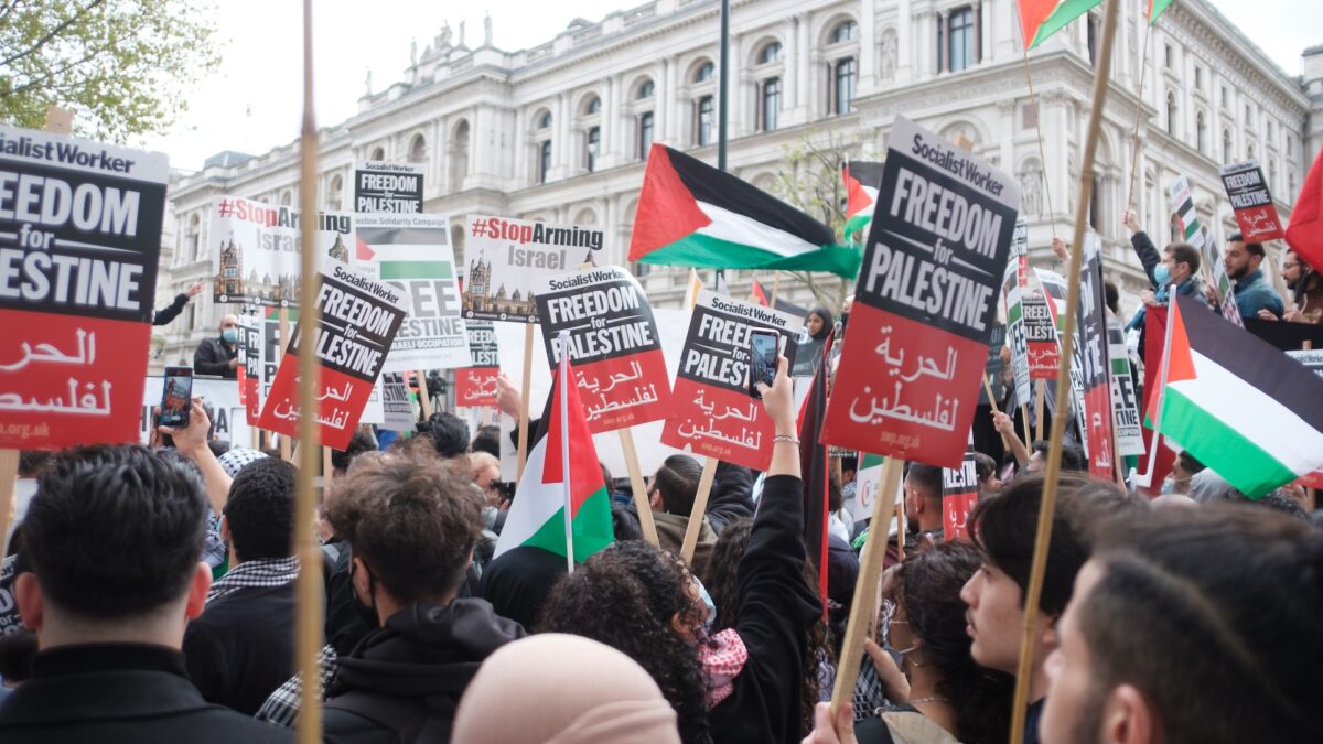 protestors with free palestine signs